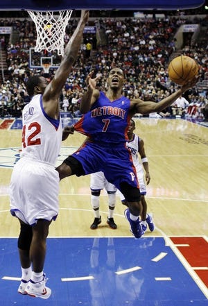 The Pistons' Brandon Knight (7) goes up for a shot as the
Sixers' Elton Brand defends in the first half Saturday night.