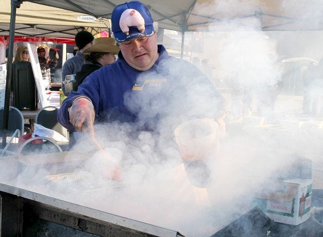 EJ Hersom/Staff photographer
Joe Martel of Mainely BBQ and Company grills chicken for the Redhook Brewery Polar Grill Fest Saturday in Portsmouth.