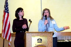 Farm women Emily Webel of Knox County and Holly Spangler of Fulton County share experiences related to their communication efforts with city moms during the Knox County Farm Bureau's annual meeting on Saturday.