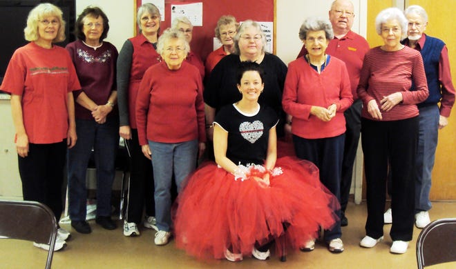 Ionia County Commission on Aging Wellness Technician, Erin Coltvet, poses in a red tutu with Enhance Fitness participants at last year’s National Wear Red Day event. This year, the commission will offer Enhance Fitness classes, healthy snacks, a photo booth and cardiac screenings provided by Sparrow Ionia Hospital.