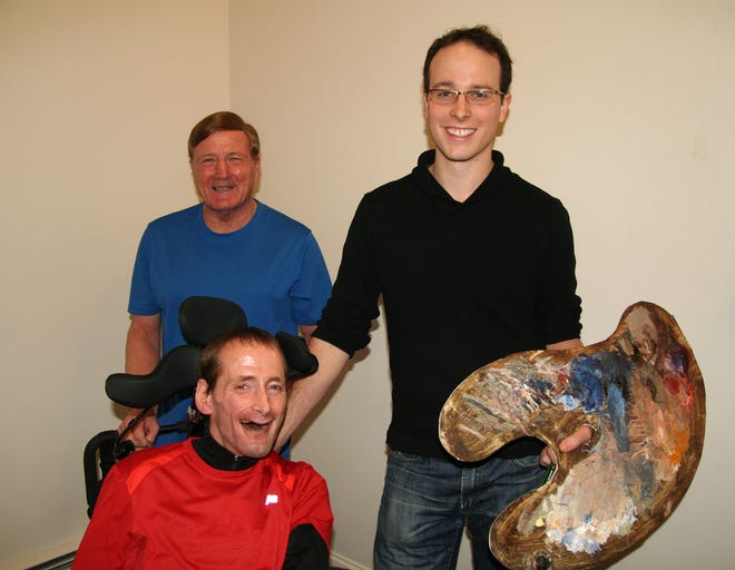 Hopkinton artist Dustin Neece, right, has a commission from Easter Seals Massachusetts to paint famed father-and-son race duo Dick and Rick Hoyt.