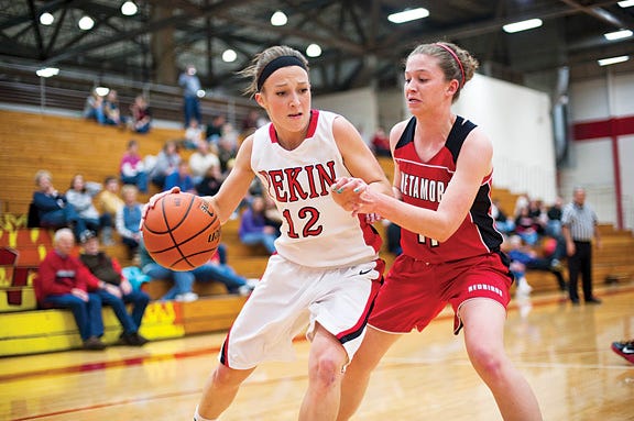Pekin's Maddi Carr charges towards the hoop while Metamora's Cassidy Lorerger defends during their game Saturday.
Skyler Edwards / Times staff
? More photos at www.pekintimes.com