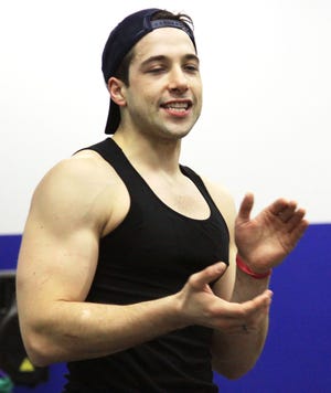 At In Sync Center of the Arts, located in Quincy, Vince Oddo, who plays Favorite Son in the theatrical version of American Idiot, teaches dance steps to dance students, Sunday, Jan. 29, 2012.