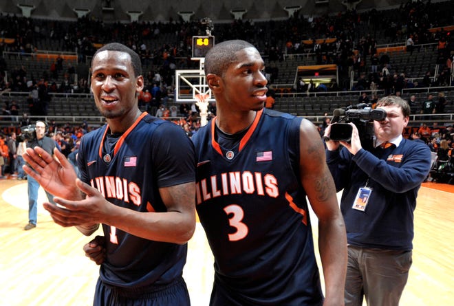 Illinois guard D.J. Richardson (1) and guard Brandon Paul (3) celebrate after Illinois defeated Michigan State 42-41 in an NCAA college basketball game at Assembly Hall in Champaign, Ill., on Tuesday, Jan. 31, 2012. (AP Photo/John Dixon)