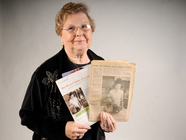 Wilmington resident Nadean Burns holds an article about her in the January/February 2012 issue of Gardening How-To (left) and an Aug. 7, 1970, Wilmington Morning Star feature story about how she grew a coconut tree.