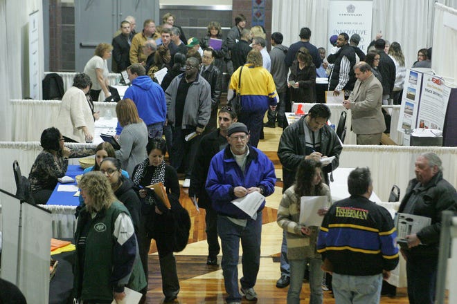 People attend a job fair sponsored by The Workforce Connection on Thursday, Feb. 2, 2012, held at the Community Building Complex of Boone County in Belvidere.