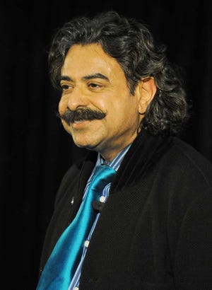 bob.self@jacksonville.com--12/16/11--Jaguars new owner Shahid Khan taking questions from the media. Jacksonville Jaguars former team owner Wayne Weaver introduced the team's new owner, Shahid Khan to the media and local officials Friday afternoon in the West Touchdown Club of EverBank Field.  (The Florida Times-Union, Bob Self)