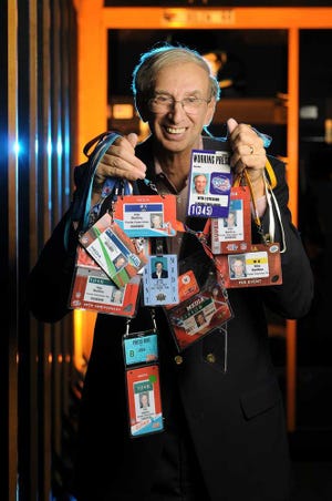 bob.self@jacksonville.com Times-Union sports writer Vito Stellino holds some of the credentials he has accumulated from attending the last 39 Super Bowls.