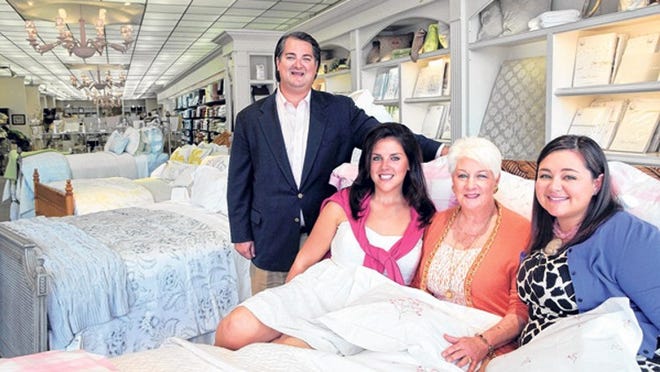 Penny Murphy (second from right) and her three children who work with her at Pioneer Linens -- Alan Murphy Jr., Camille Murphy and Marissa Murphy.
