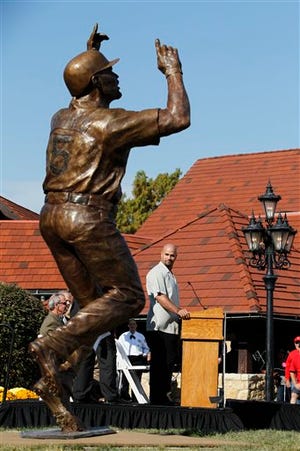 Baseball player Albert Pujols during the dedication of a 10-foot, 1,100-pound bronze statue of the St. Louis Cardinals slugger Wednesday, Nov. 2, 2011, in Maryland Heights, Mo. (AP Photo/Jeff Roberson)