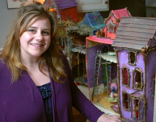 Mary Fontanez with some of her doll houses in her Bartonsville home on Thursday, January 26, 2012. She makes the houses from recycled materials such as cardboard boxes and newspaper.