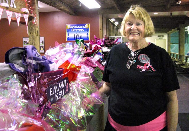 Ann Anderson, director of tennis promotions and a tennis pro at Wood Valley Racquet and Fitness, shows off some of the gift baskets that will be auctioned during this year's Ribbons in Pink Rally for the Cure. The event will be from 4 to 7 p.m. Saturday (Feb. 11) at Wood Valley Racquet and Fitness, 2909 S.W. 37th St.