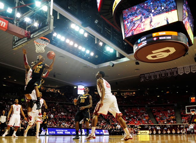 Missouri’s Marcus Denmon makes a reverse layup in the second half of Monday night’s 71-68 victory over Oklahoma in the Lloyd Noble Center. Denmon scored 25 points, giving him 54 in his last two games.
