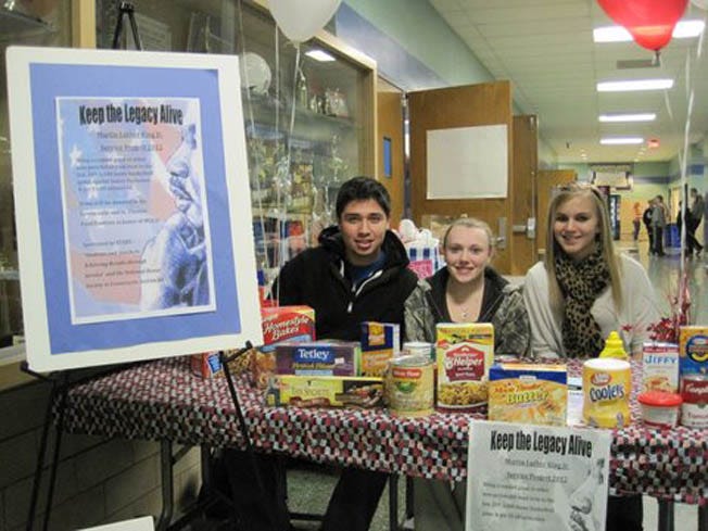 Greencastle-Antrim High School Civics students who collected food for local food banks at the Jan. 20 home game against James Buchanan are, from left: Carlos Ruilowa, Shelby Arnold and Brittany Lane.