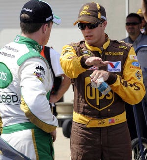 Tom Strickland Associated Press David Ragan (right) talks with Carl Edwards at the Indianapolis Motor Speedway last July.