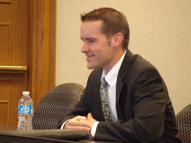 Derek Todd, a management consultant and former town administrator of Frederick, Colo., talks to a committee.