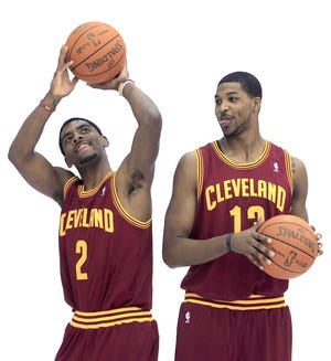 Cleveland Cavaliers' Kyrie Irving, left, and Tristan Thompson joke around during media day at the NBA basketball team's training camp, Monday, Dec. 12, 2011, in Independence, Ohio.