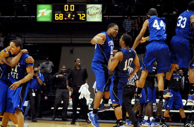 Tennessee State players celebrate their 72-68 win against No. 9 Murray State on Thursday night in Murray, Ky. Murray State was the last unbeaten team in Division I.
