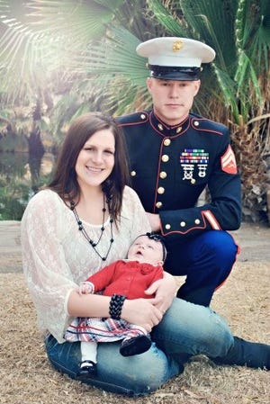 Russell York Beckley Jr. with his wife, Danielle, and daughter, Braelynn.
