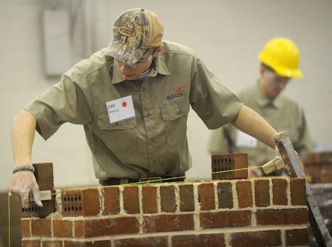 Josh Silfee, Pleasant Valley senior competes in masonry
in the District 11 SkillsUSA Championships at the Agri-Plex in Allentown on February1, 2012.