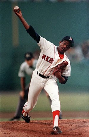 FILE - In this Aug. 5, 1986, file photo, Boston Red Sox pitcher Dennis "Oil Can'" Boyd pitches against the Chicago White Sox during a baseball game at Fenway Park in Boston. Boyd said during an interview with Jon Miller of WBZ radio in Boston, he probably pitched under the influence of cocaine "at every ballpark" during his 10-year career. "There wasn't one ballpark that I probably didn't stay up all night, until 4 or 5 in the morning, and the same thing is in your system," Boyd said.