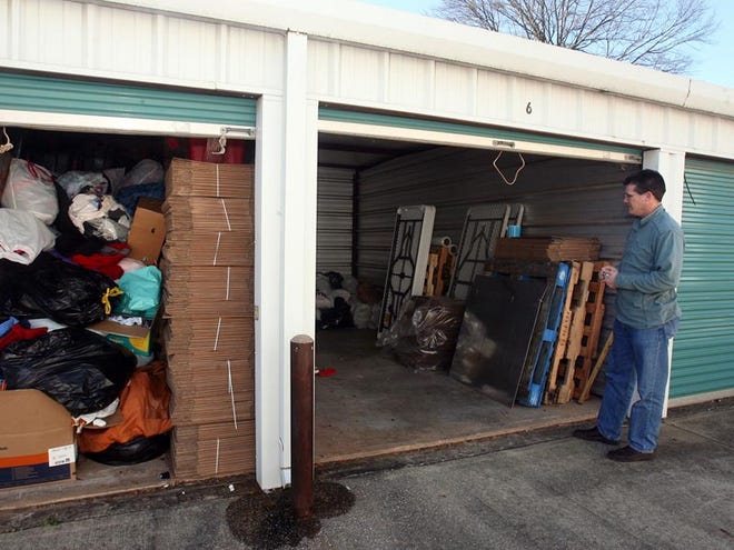 Mark Seagle looks in a storage unit where donations for missions collected by Valley View Baptist Church, partnering with Baptist Medical Dental Missions, are stored on Tuesday. Seagle said items were stolen from the units.