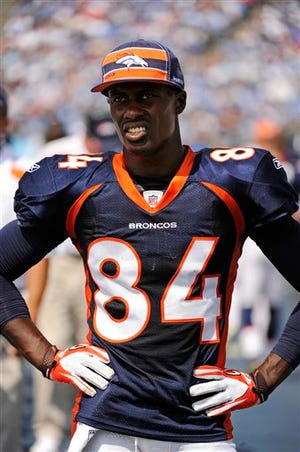 In this Sept. 25, 2011, photo, Denver Broncos wide receiver Brandon Lloyd (84) watches from the sideline during the second quarter of an NFL football game against the Tennessee Titans, in Nashville, Tenn. Pro Bowl receiver Lloyd, who led the league in yards receiving last year, isn't catching any deep passes in new Broncos coach John Fox's conservative, dink-and-dunk offense and he's letting his quarterback and his coaches know how he feels about it. (AP Photo/Frederick Breedon)