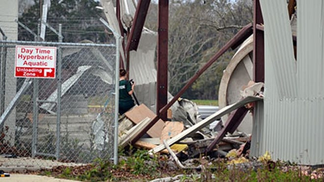 Authorities investigate the scene of a hyperbaric-chamber explosion at an equine-therapy facility in Ocala that killed a woman and a horse Friday.
