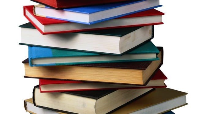 ORG XMIT: EM2R792R Stack of books, back to school, school books, sunstock, textbooks photos.com stock