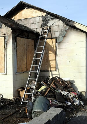 The Hill Street home in Hopedale ravaged by a fire on Wednesday has been boarded up.