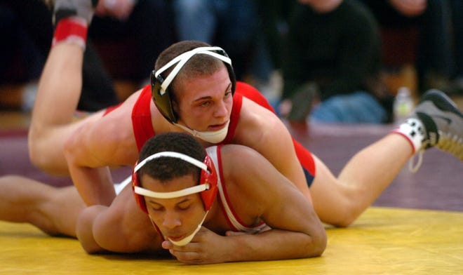 Bridgewater-Raynham's Aaron Conrad, top, takes on New Bedford's Savon Soares in the semifinals of the 160-pound division of the Div. 1 state wrestling meet at Weymouth High School on Saturday. Conrad advanced to the final, where he was victorious.

photo; Amelia Kunhardt/The Patriot Ledger