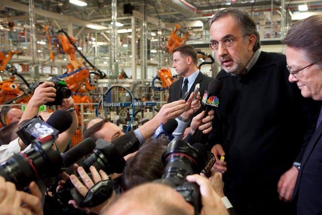 Chrysler Chairman and CEO Sergio Marchionne talks to reporters Thursday, Feb. 2, 2012, after a party for the new Dodge Dart at the Belvidere Assembly Plant.