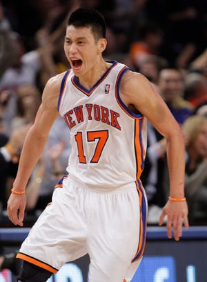 The Knicks' Jeremy Lin celebrates after a making a 3-point basket during the second half of his team's 92-85 win over the Lakers on Friday night in New York.