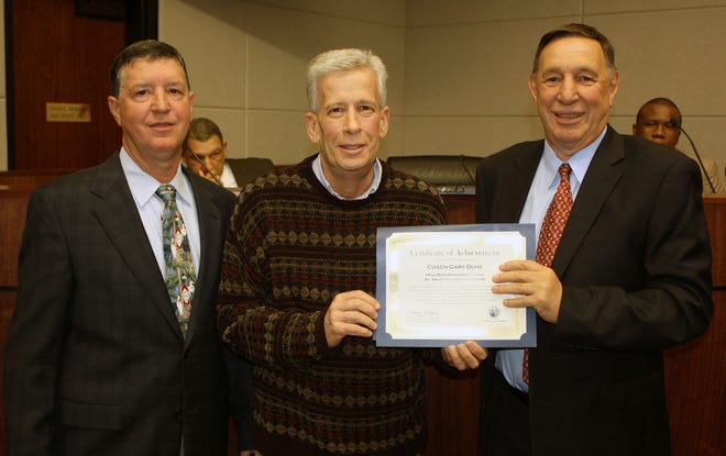 Shown from left to right: Councilman Kent Schexnaydre, Coach Gary Duhe and Ascension Parish President Tommy Martinez.