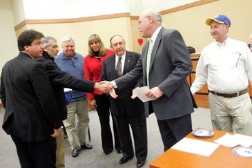 Photo by Daniel Freel/New Jersey Herald Sparta Township Councilman Gilbert Gibbs, second from right, congratulates members of the Kiwanis Club as they are honored with a Sparta Patriot Award during a council meeting Tuesday.