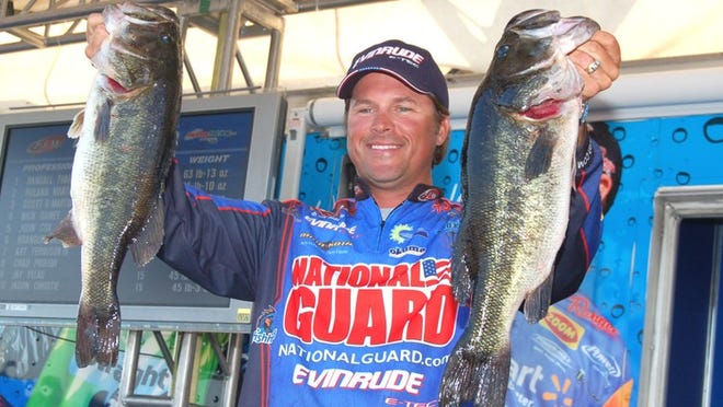 Scott Martin of Clewiston shows two bass caught Saturday during the FLW Tour on Lake Okeechobee. The National Guard pro finished eighth with 56 pounds, 3 ounces. In August, he won $601,000 at the Forrest Wood Cup by beating Randall Tharp, who won the FLW Tour event on Lake Okeechobee.