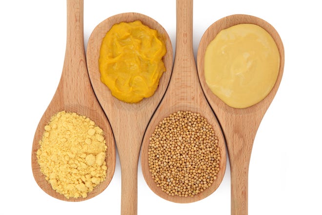 • Mustard comes in four types (from left): powdered for cooking, yellow prepared with turmeric, seeds for pickling and brown, the strongest version.