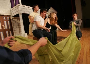 Photo by Daniel Freel/New Jersey Herald Hopatcong High School students, from left, Evyn Tarvydas, as Hero, Steven Munoz, as Pseudolus, Brooke O’Donnell, as Philia, and Sean Camlin, as a Prodian, run through a scene of “A Funny Thing Happened on the Way to