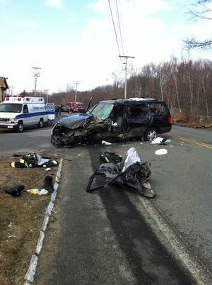 MedFlight was called to transport the driver of this SUV, which was in a collision with an oil truck at Adam and Oak streets in Abington on Friday, Feb. 17, 2012./