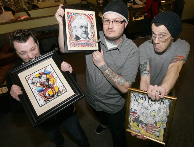 INDEPENDENT GLENN B. DETTMAN
n Three of the 43 presidents are represented here by tattoo artists at Art Bomb Tattoos. They are (left to right) Chris Bragg with Grover Cleveland, T.J. Heaton with James Buchanan and Josh Soliday with Martin Van Buren. All 43 pieces of art will be offered for sale for only $25 each at Art Bomb Tattoos on Saturday from 7 pm until 1 am.