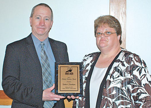 Scott Parker, accompanied by his wife, Bernice, received the F.M. Mansfield Business Award on behalf of Parker Ace Hardware at the 123rd annual Sault Area Chamber of Commerce Meeting and Awards Banquet Thursday evening at Kewadin Casino.