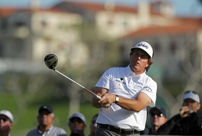 Phil Mickelson watches his drive off of the 15th tee during the second round of the Northern Trust Open golf tournament at Riviera Country Club in Los Angeles, Friday, Feb. 17, 2012. (AP Photo/Reed Saxon)