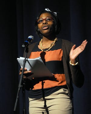 Lincoln-Sudbury Regional High School student Jahnea Johnson a poem during the school's 23rd annual Martin Luther King Jr. Assembly Friday.