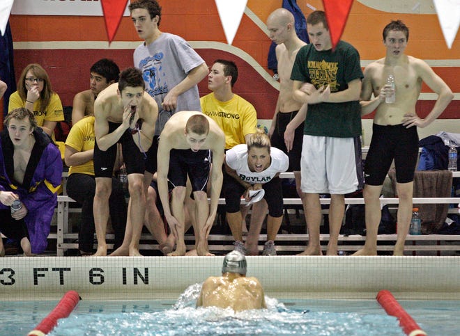 The Boylan High School team cheers on Jack Tribble as he swims 200-yard individual medley Saturday, Feb. 18, 2012, during the IHSA Sectional Finals at Jefferson High School in Rockford.