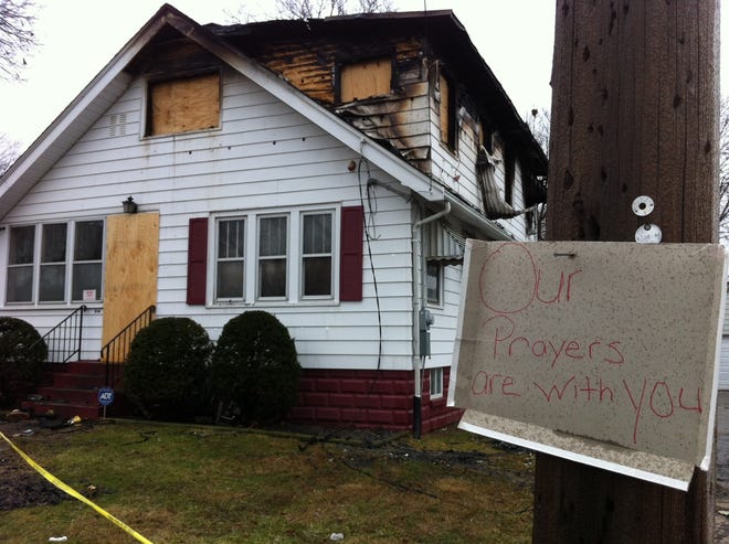 A fire early Saturday morning claimed the life of a man and two of his children at 616 E. Gift Ave. Later in the day, a sign expressing condolences appeared on a utility pole outside the home.
