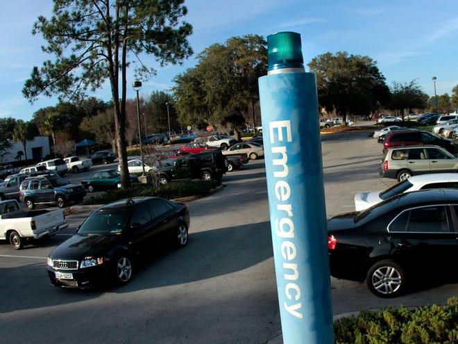 A car drives past an emergency alert station in a parking lot at Santa Fe College, in Gainesville Jan. 23, 2012.