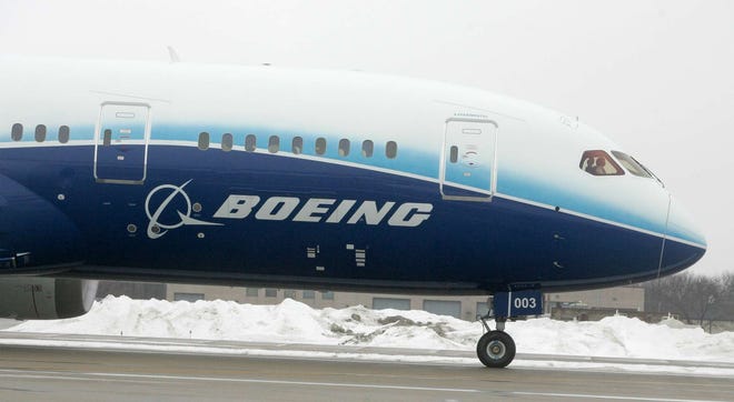 The Boeing 787 Dreamliner taxis Monday, Jan. 23, 2012, after landing at Chicago Rockford International Airport.