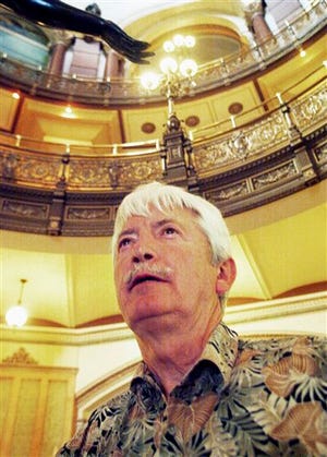 In this May 4, 2006 photo, Richard Wallace, the former CEO of Downstate Transportation Services in Carterville, Ill., is seen at the state Capitol in Springfield, Ill., where he came to lobby for the reinstatement of the medical transportation service that lost its certification after its conviction for fraudulently billing the state's Medicaid program. In July of 2006, Wallace was indicted on federal health care and mail fraud charges and convicted in February 2007. He was sentenced to three years in prison. An investigation released Tuesday, Feb. 21, 2012, found that Illinois Department of Human Services officials approved $1.7 million in payments to Downstate despite the company's conviction for fraudulently billing the state's Medicaid program for $400,000. (AP Photo/The Southern Illinoisan, Nicole Sack)