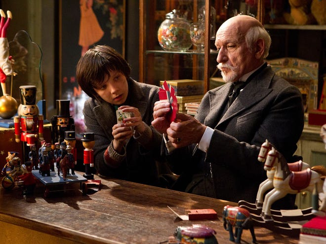 In this film image released by Paramount Pictures, Asa Butterfield portrays Hugo Cabret, left, and Ben Kingsley portrays Georges Melies in a scene from the Oscar-nominated "Hugo." The leader with 11 nominations, "Hugo" was made by Martin Scorsese, arguably Hollywood's biggest cheerleader for the rediscovery and preservation of early films. (AP Photo/Paramount Pictures) )