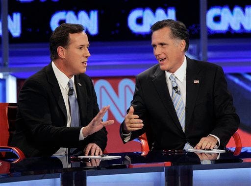 Republican presidential candidates, former Massachusetts Gov. Mitt Romney, right, and former Pennsylvania Sen. Rick Santorum argue a point during a Republican presidential debate Wednesday, Feb. 22, 2012, in Mesa, Ariz.